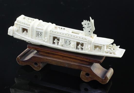 A Chinese ivory model of a boat, early 20th century, 15.5cm, wood stand